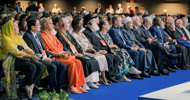 The picture shows eminent participants in the International Interfaith Meeting in Germany, with Mr Hirotsugu Terasaki, second from left in the first row. Credit: Seikyo Shimbun