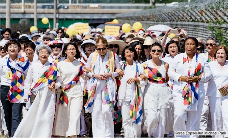 Photo: A Group of 'Women Cross Demilitarised Zone (DMZ)'