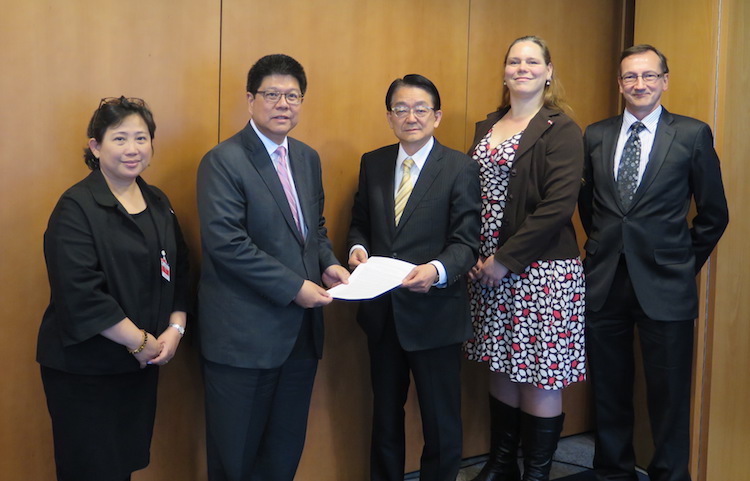 Photo: OEWG Chair Ambassador Thani Thongphakdi (second from left) receiving an interfaith statement on May 3 from representatives of PAX, the SGI and the WCC. From right to left: Peter Prove of the WCC, Susi Snyder of PAX and Hirotsugu Terasaki of the SGI. Credit: SGI | Kimiaki Kawai