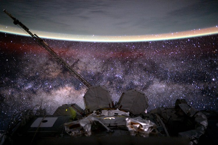 Image: Outer space from the International Space Station at 400 km (250 mi) altitude in low Earth orbit. In the background the Milky Way’s interstellar space is visible, as well as in the foreground, above Earth, the airglow of the ionosphere just below and beyond the so-defined edge of space the Kármán line in the thermosphere. Credit: NASA/Scott Kelly.