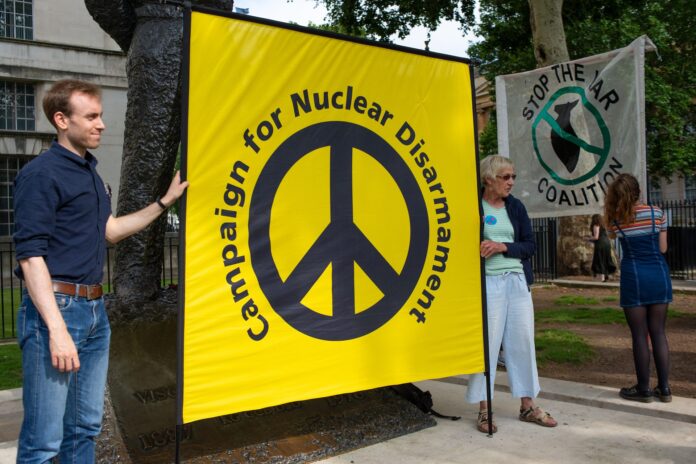 shutterstock-1920x1281 London,,Uk.,26th,June,London, UK. 26th June 2019. Anti-war protesters with banners at the DON'T ATTACK IRAN protest in Whitehall, London, to put pressure on the UK. Image Credit: shutterstock