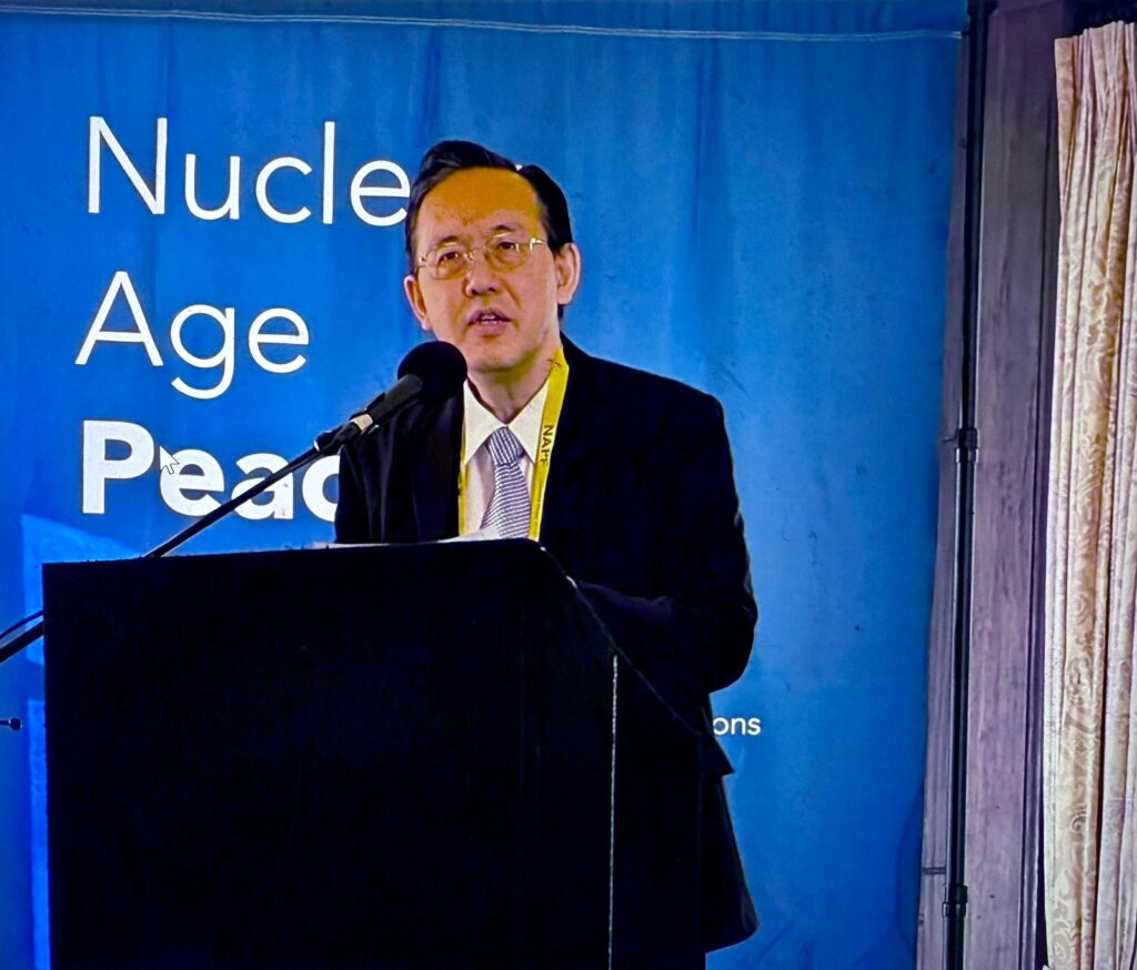 Tomohiko Aishima of SGI opens the symposium with reflections on the dialogue between Daisaku Ikeda and David Krieger, which he witnessed during his time as a reporter at Seikyo Shimbun Credit: SGI